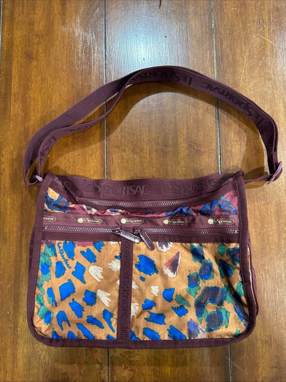 LeSportsac Deluxe Everyday Bag Abstract Animal Print Burgundy Crossbody Purse